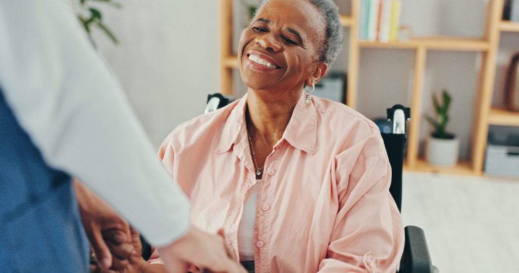 Senior Care & Physical Therapy supporting an elderly woman during assisted care